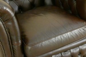 low back chesterfield chair in ant. brown