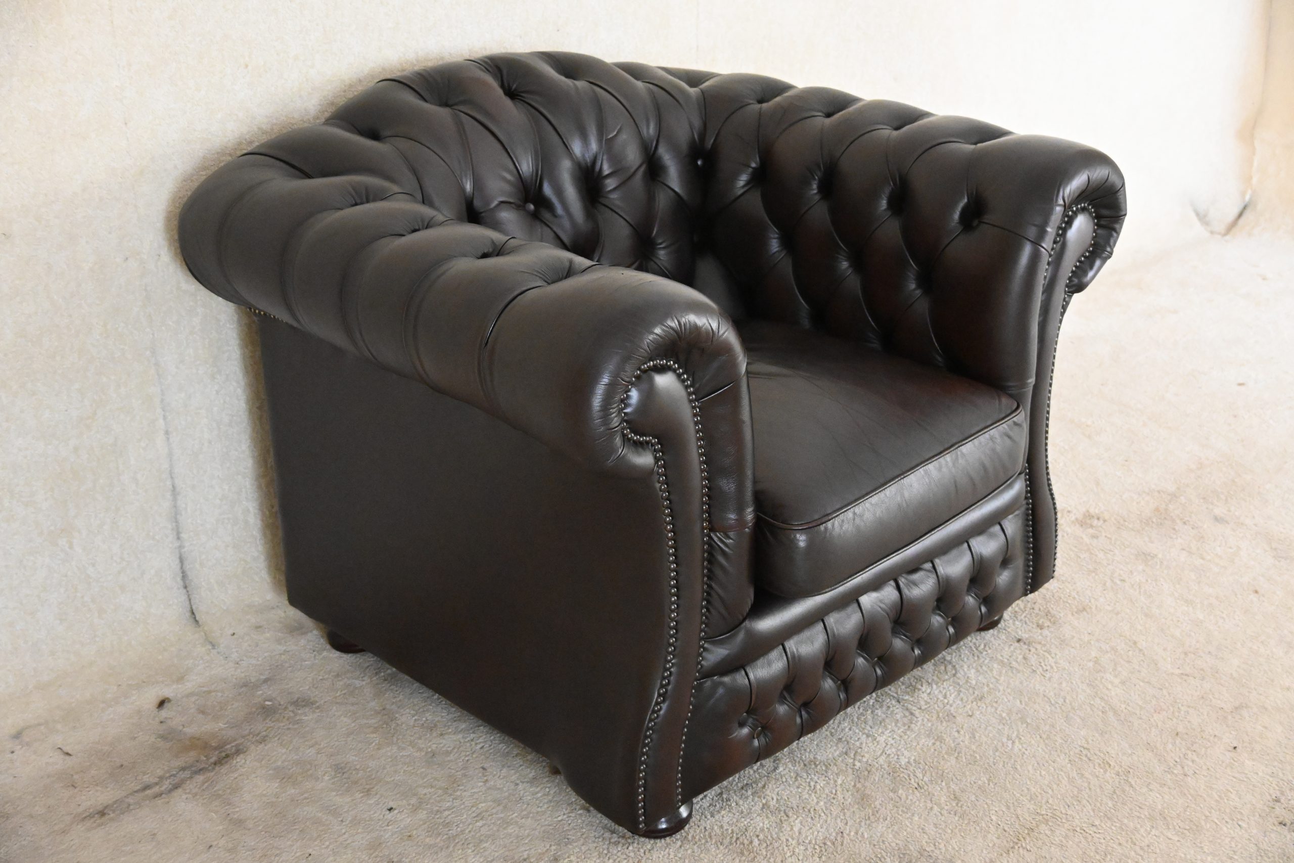 low back chesterfield chair in ant. brown